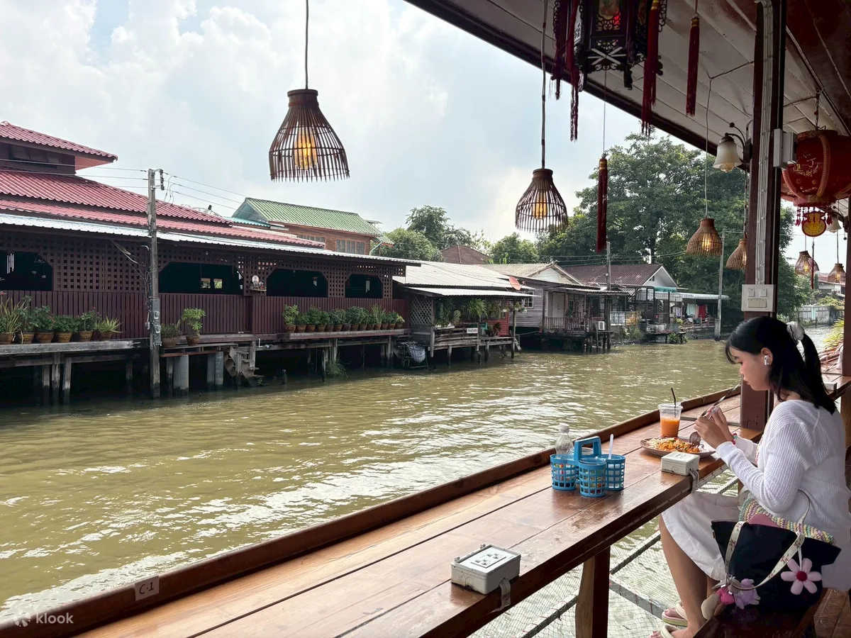 Canalside seating looking across to the stilt houses of Khlong Bang Luang
