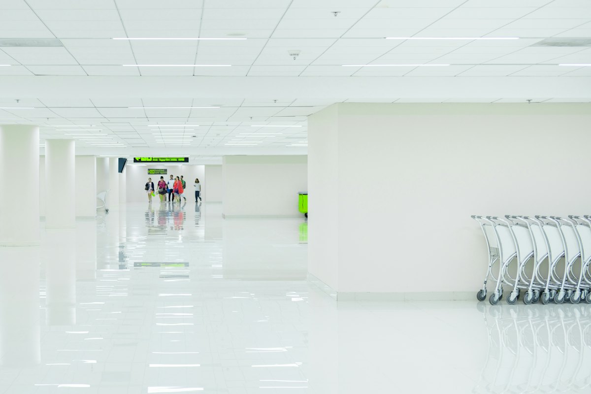 A bright, empty terminal corridor at Don Mueang International Airport in Bangkok