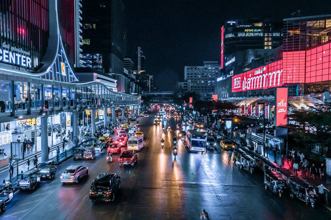 Siam shopping district lit up at night in Bangkok