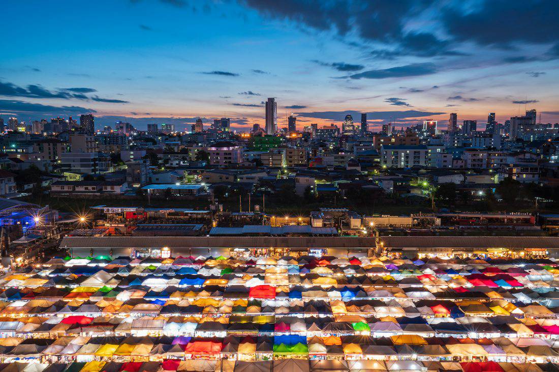 Colorful tents of a Bangkok night market seen from above