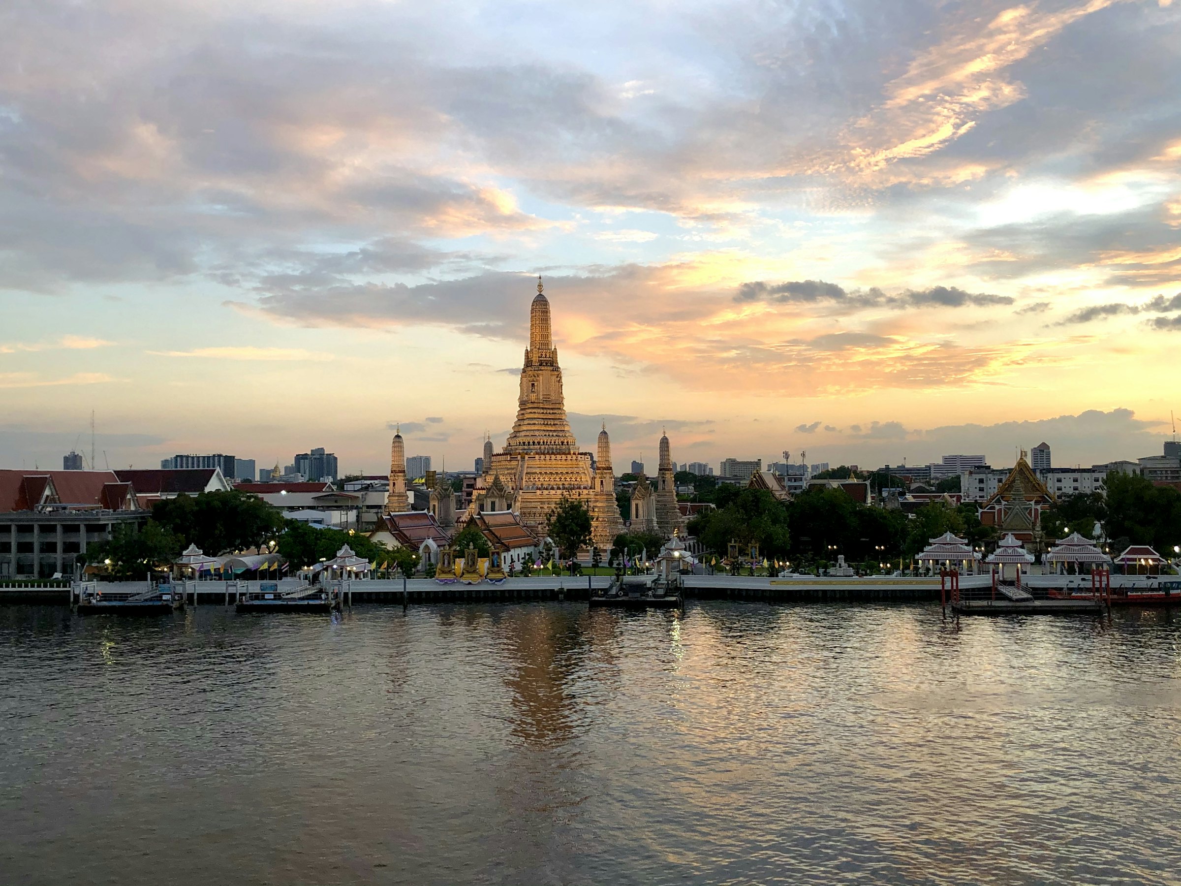 Wat Arun at sunset, seen across the Chao Phraya River