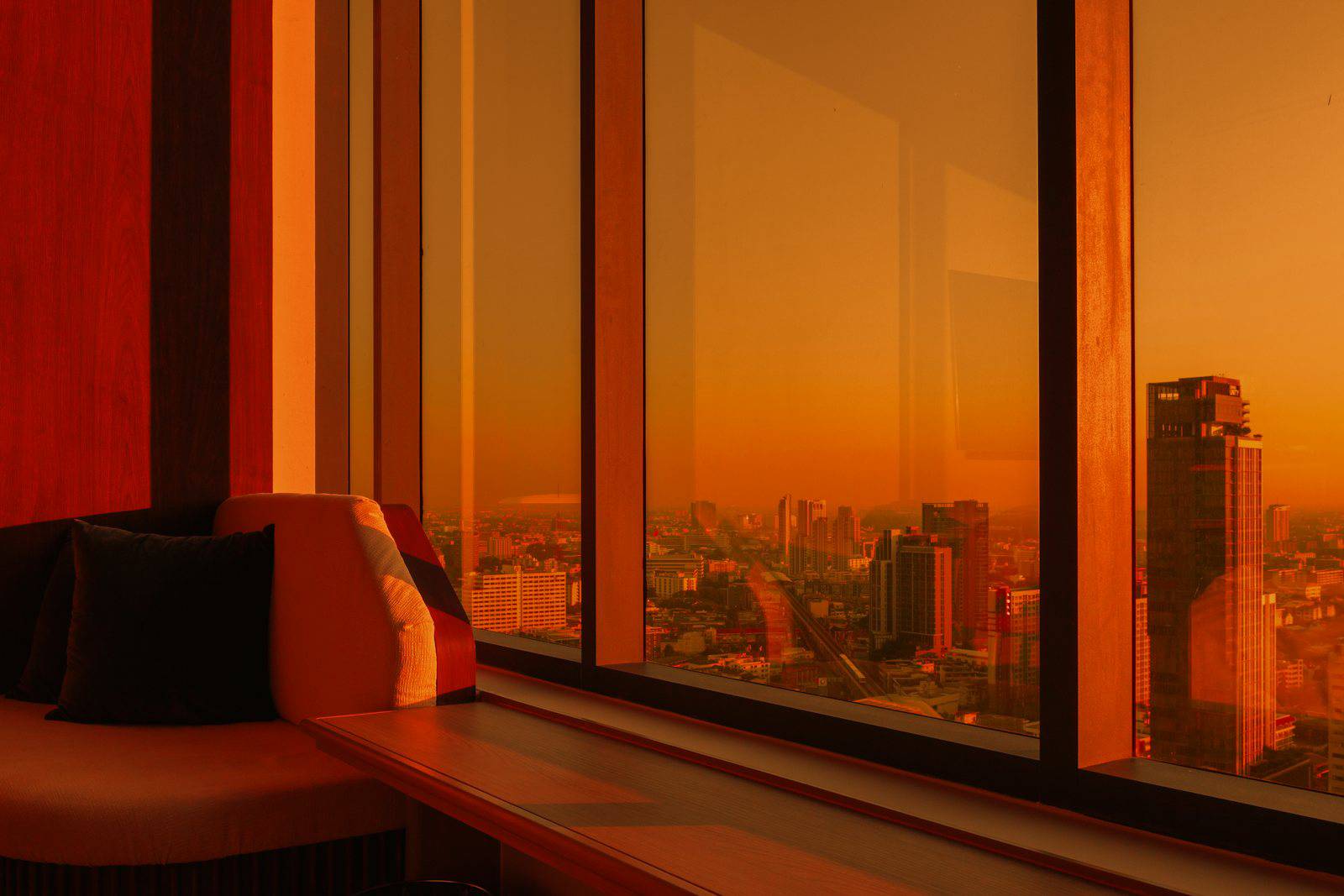 Bangkok hotel room with a sunset view over the city
