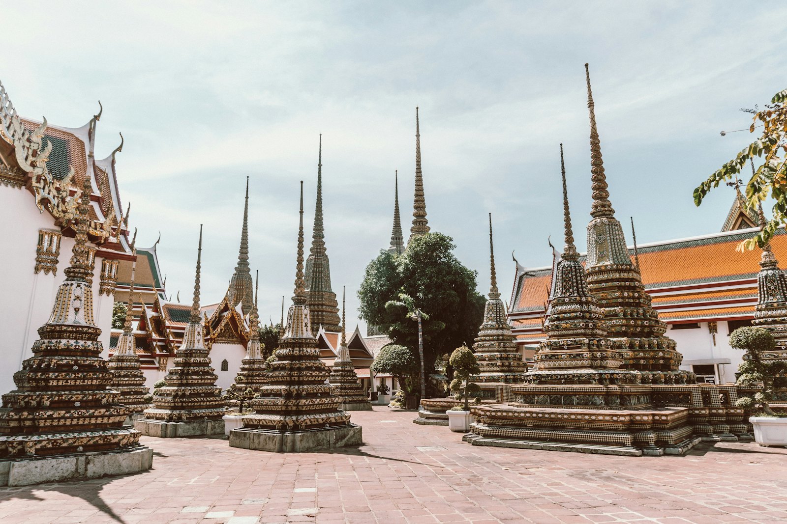 Tiled chedis standing in the courtyard at Wat Pho